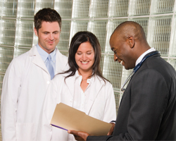 Image: Doctors reading file