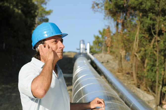 Image: Worker near pipeline