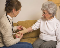 Image: Doctor bandaging patients hand