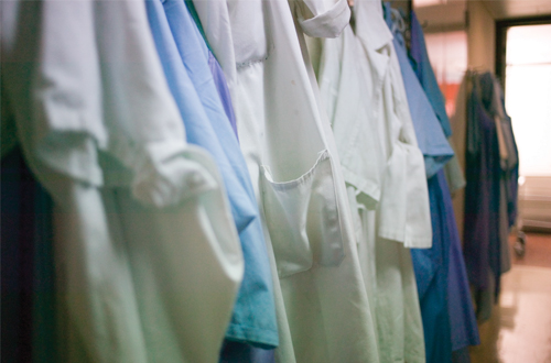 Photo: Lab coats hanging up