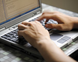 Image: Typing on a laptop