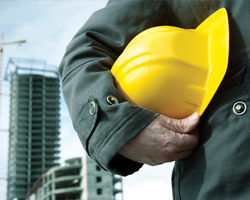 Image: Worker carrying worksite helmet