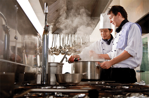Photo: Two chefs working in a kitchen