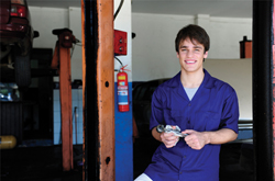 Image: Young man working in a garage